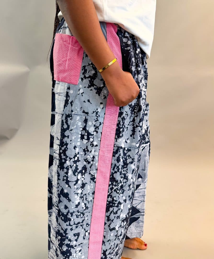 Model wearing the Midi Pants with Aso-Oke (Unisex) in black and white